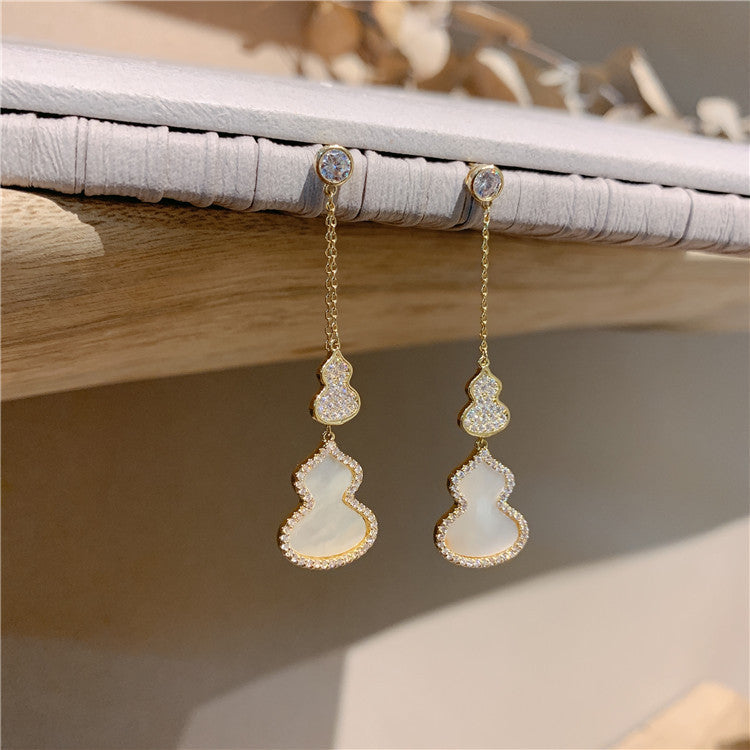 Boucles d’oreilles en forme de calebasse