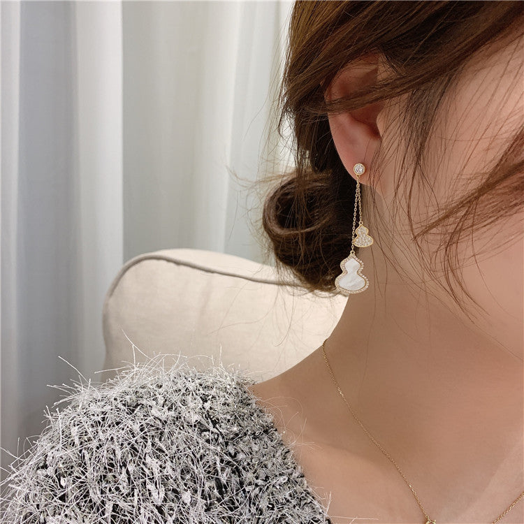 Boucles d’oreilles en forme de calebasse