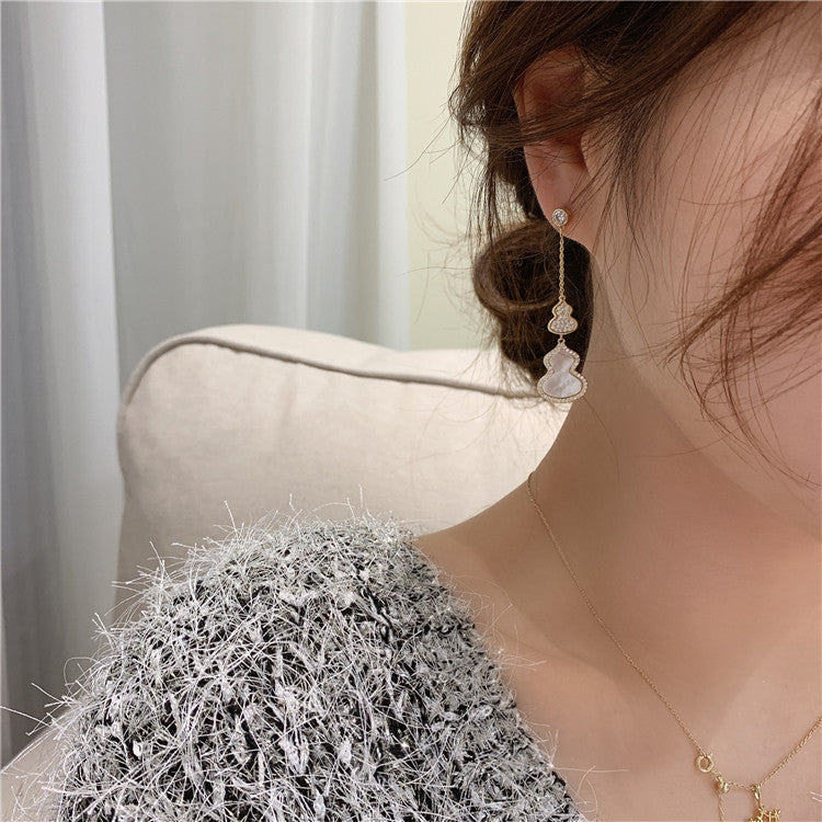 Boucles d’oreilles en forme de calebasse