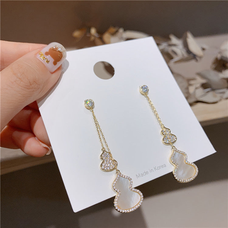 Boucles d’oreilles en forme de calebasse